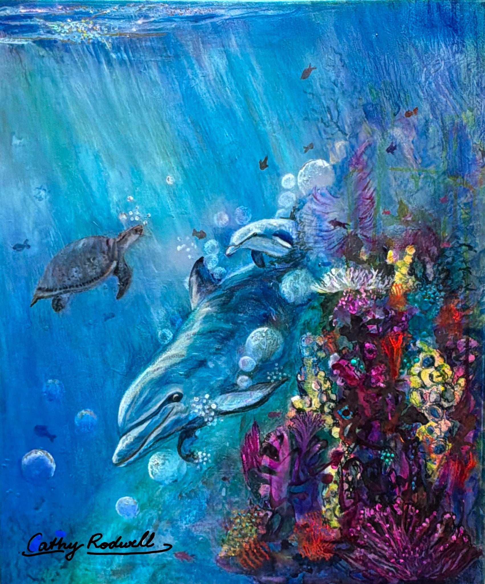Reef Ballet by Cathy Rodwell, an original oil painting of a dolphin and sea turtle swimming through a colourful coral reef in radiant blue water.
